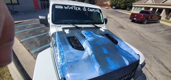 Jeep with a printed White Walker hood wrap and Winter is Coming windshield banner