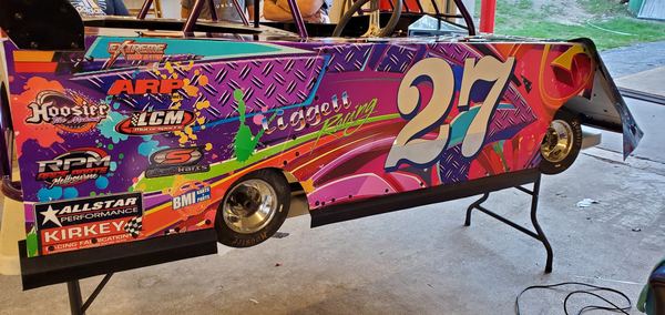 Dirt late model race car side panel wrapped with Liggett Racing number 27 graphics